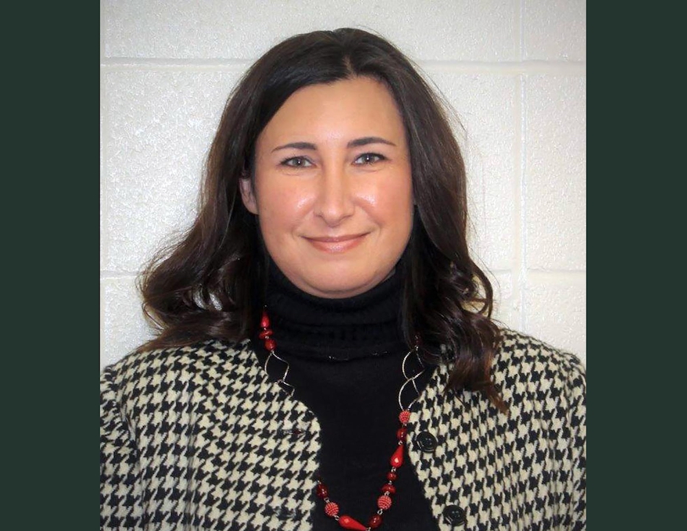 A woman in a black and white jacket