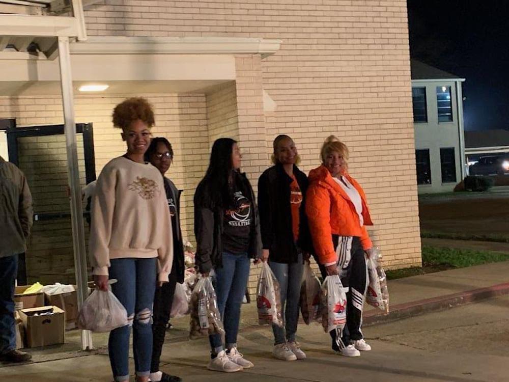 A group of people walking down the street.