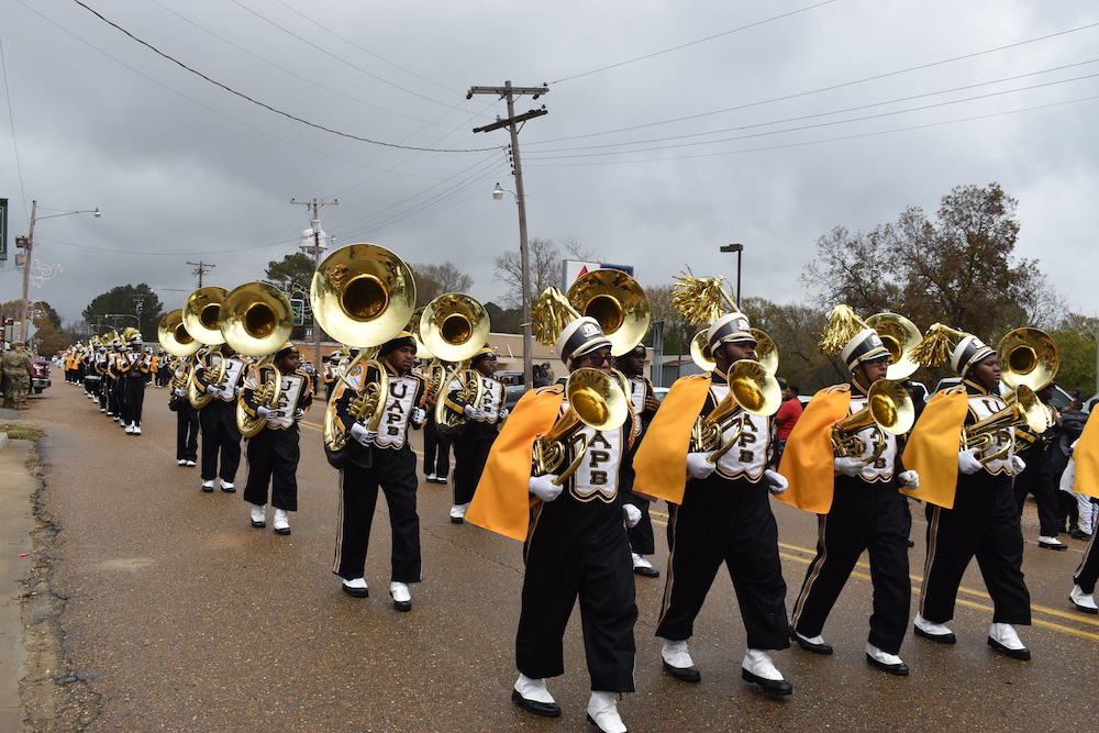 A group of people in marching band uniforms.