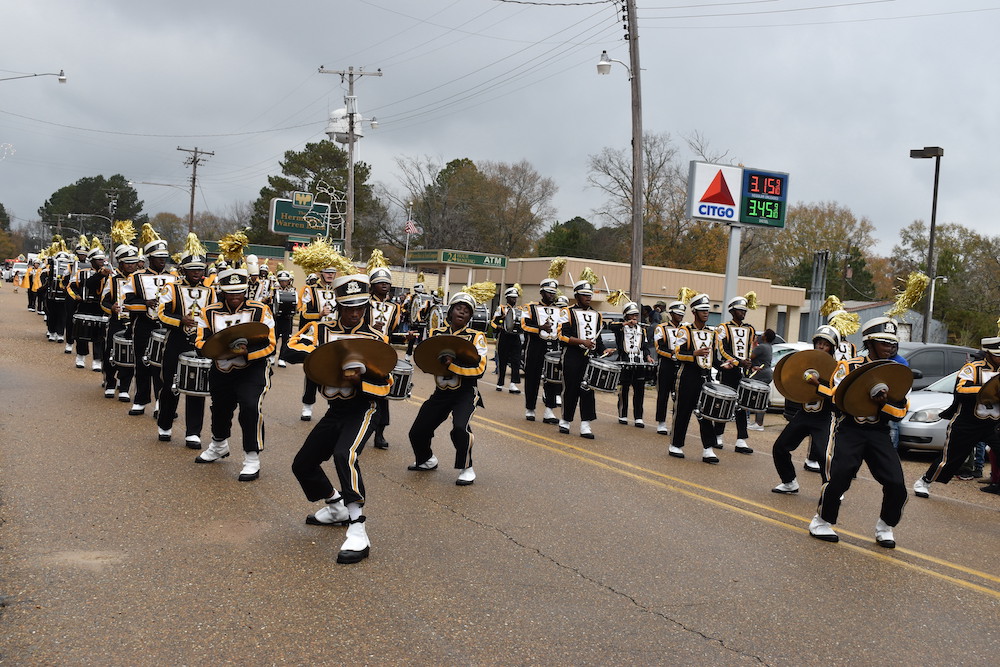 A band marching down the street in a parade.