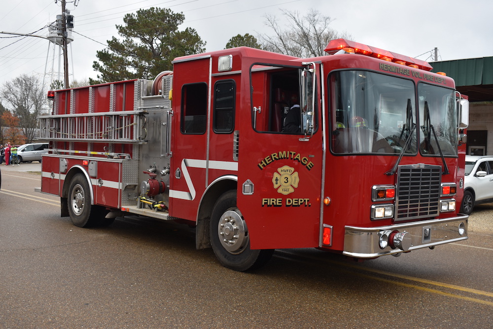 A fire truck is parked on the side of the road.