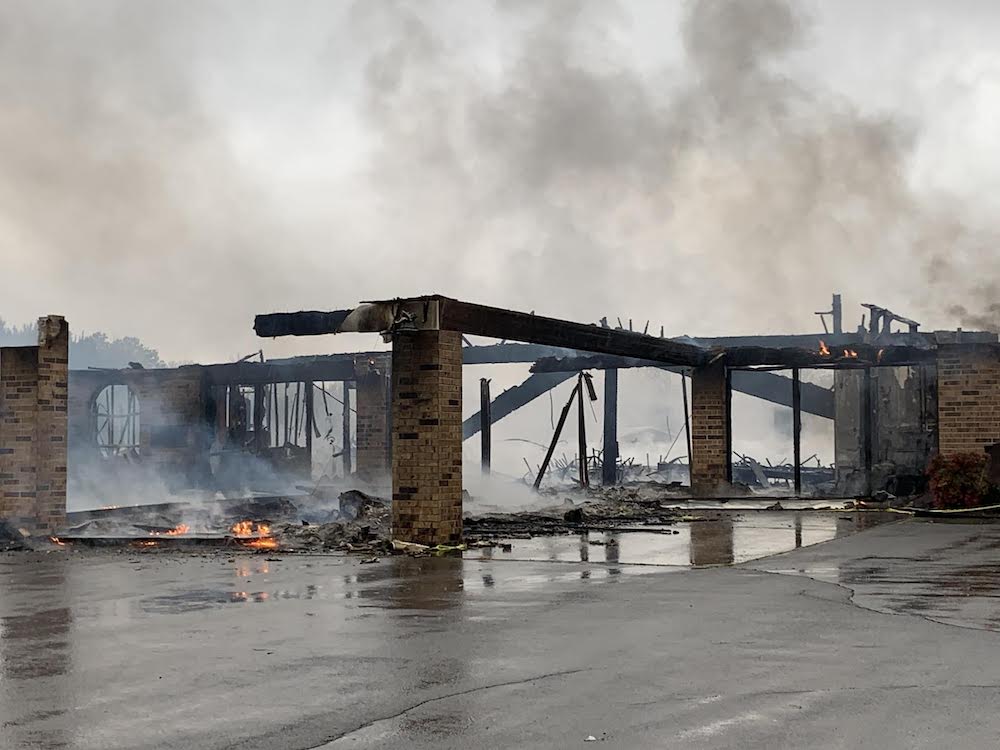 A fire that is burning in the middle of a bridge.