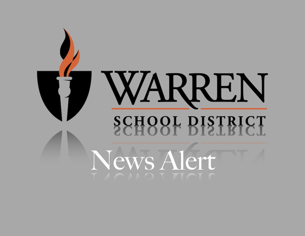 A logo for warren school district with the reflection of it.