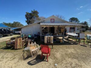 A yard full of furniture and other items.