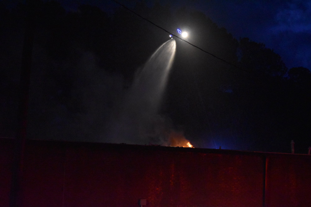 A fire truck is on the side of the road.
