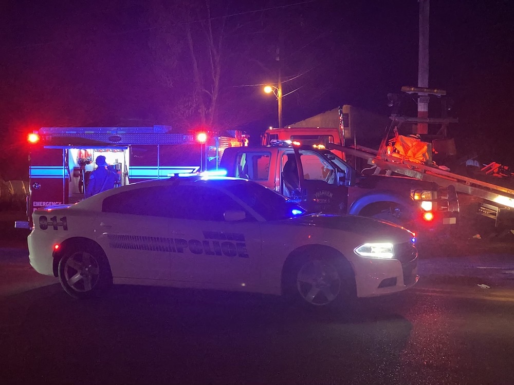 A police car is parked on the side of the road.