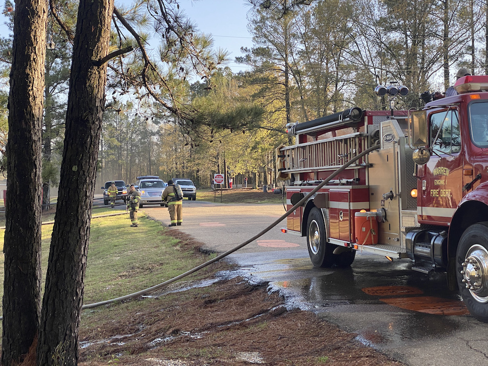 A fire truck is parked on the side of the road.