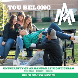 A group of people sitting on top of a bench.