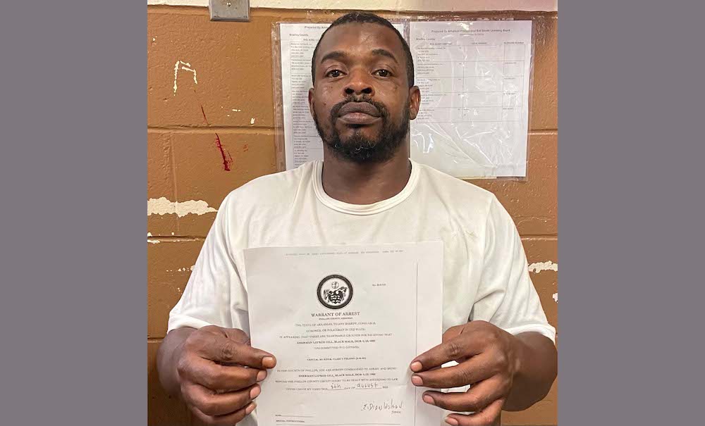 A man holding up a paper with the seal of approval.