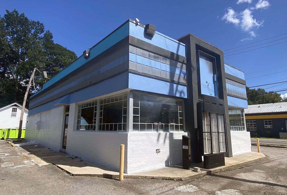 A building with a large window on the side of it.