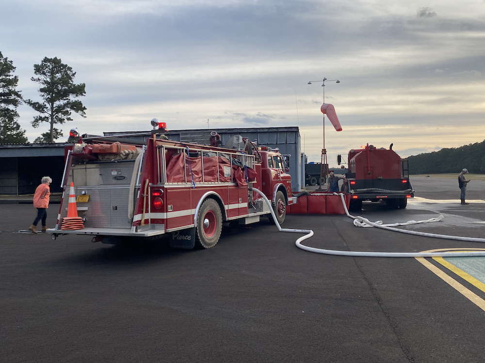 A fire truck is parked in the parking lot.