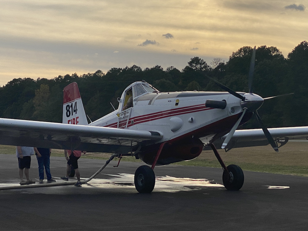 A small airplane sitting on top of an airport runway.