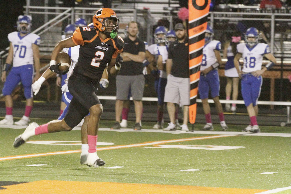 A football player running on the field