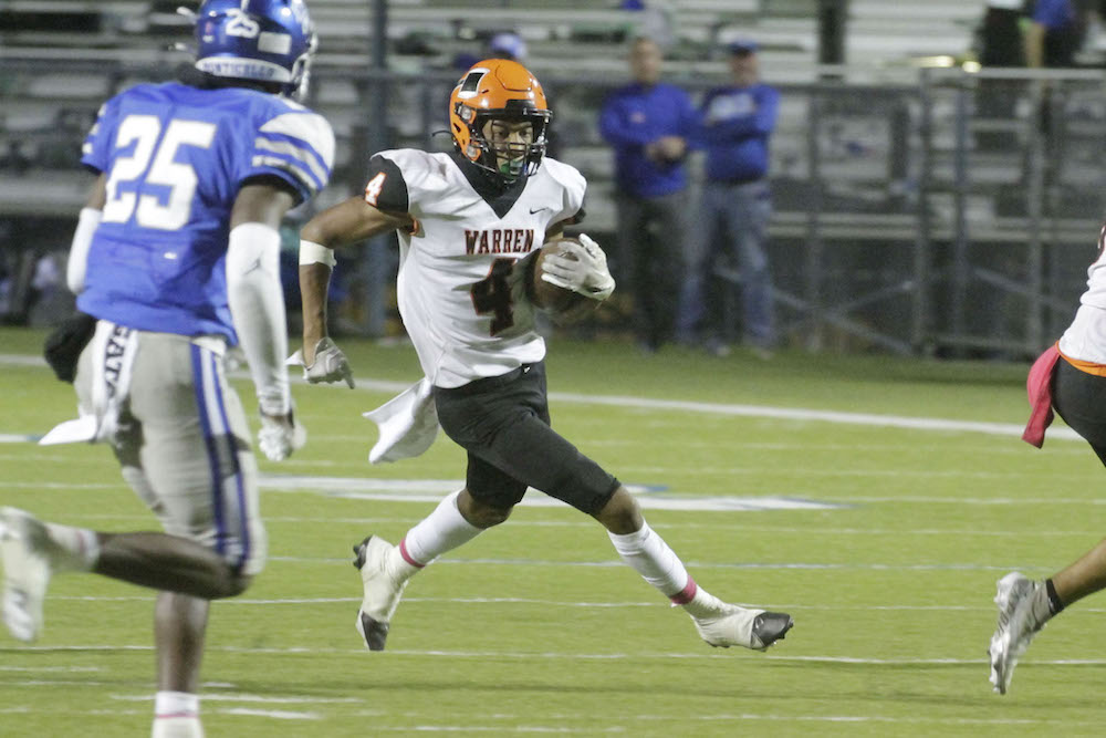A football player running for the goal line.