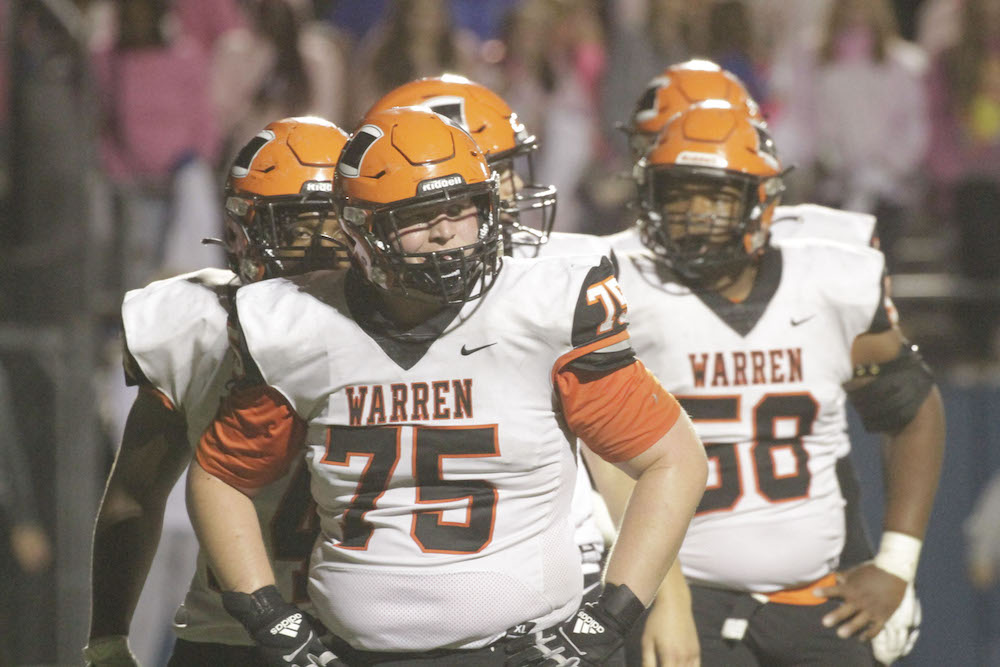 A group of football players are standing together.