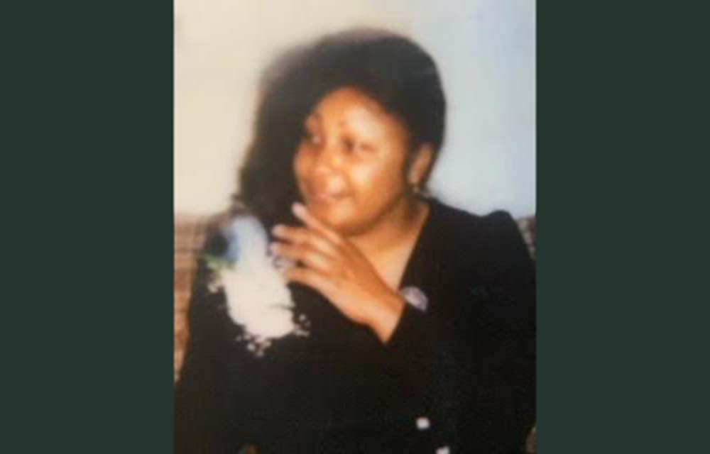 A blurry picture of a woman smoking.