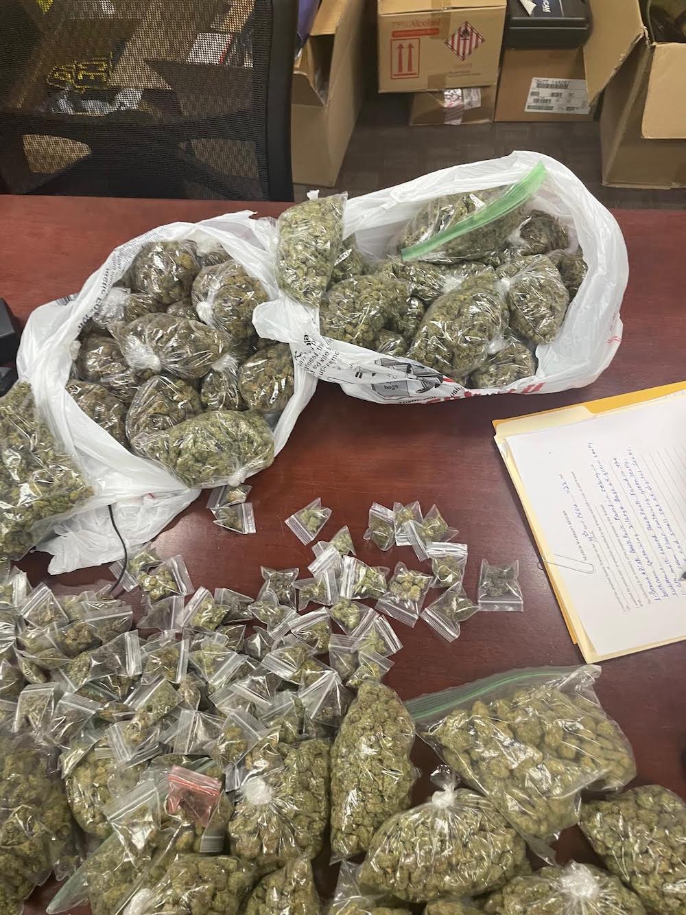 A table with some bags of marijuana on it