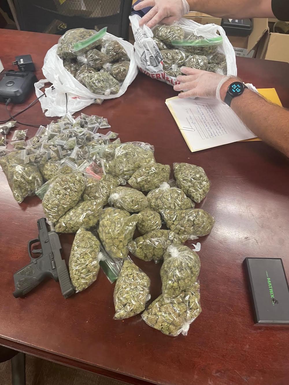 A table with several bags of marijuana on it.