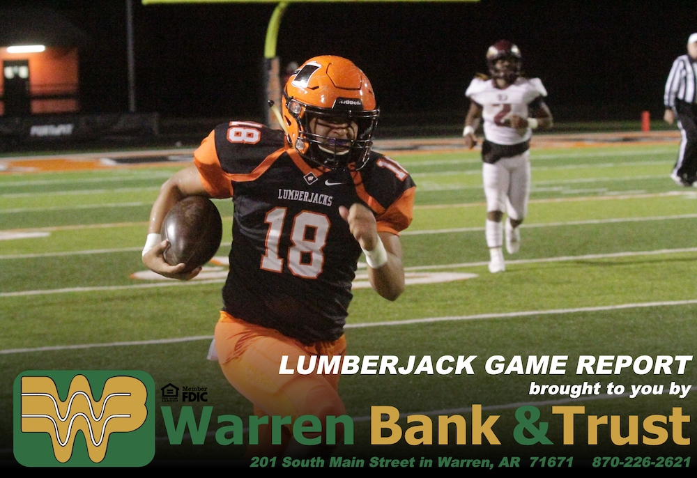 A football player running on the field with another player behind him.