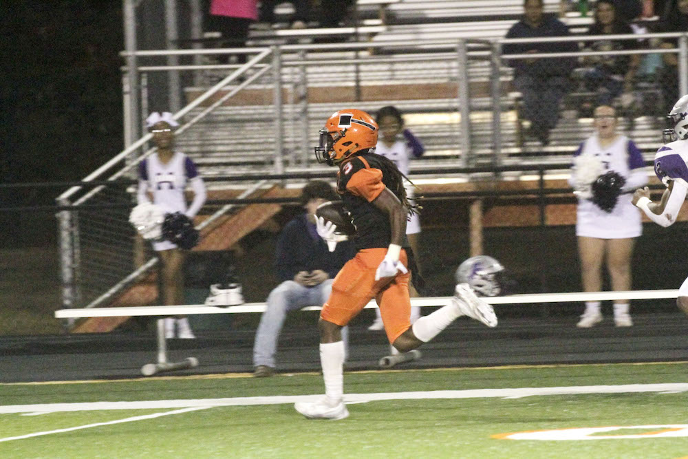 A football player running on the field