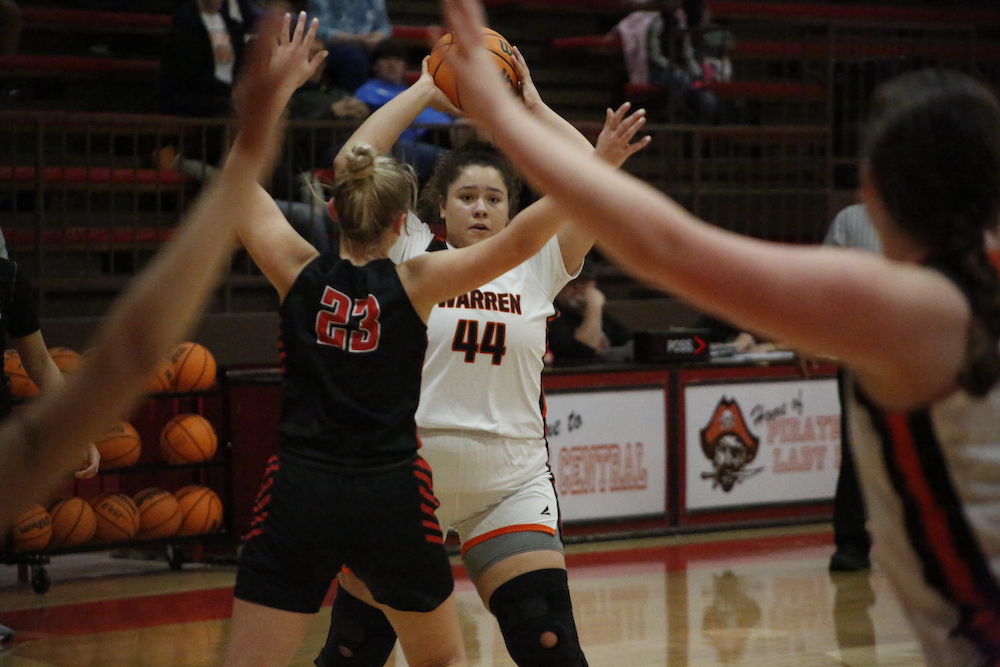 A group of girls playing basketball on the court