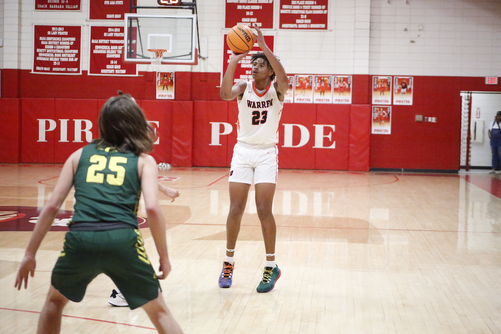 A person playing basketball on the court