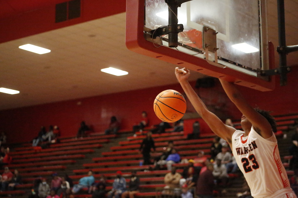 A person in the air with a basketball