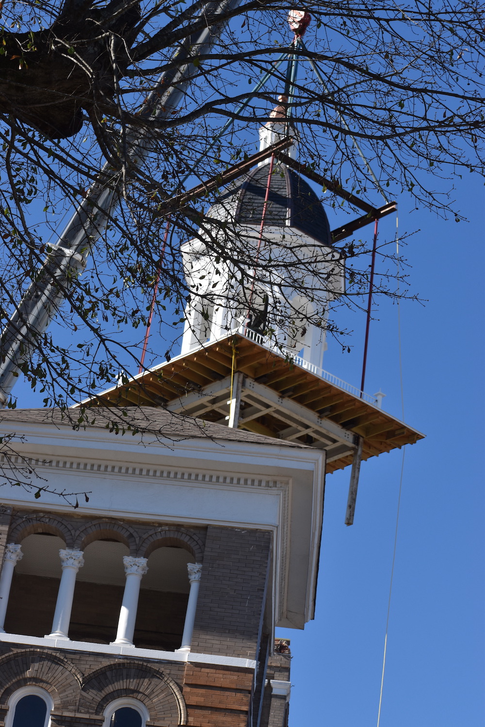 A building with a clock tower in the background.