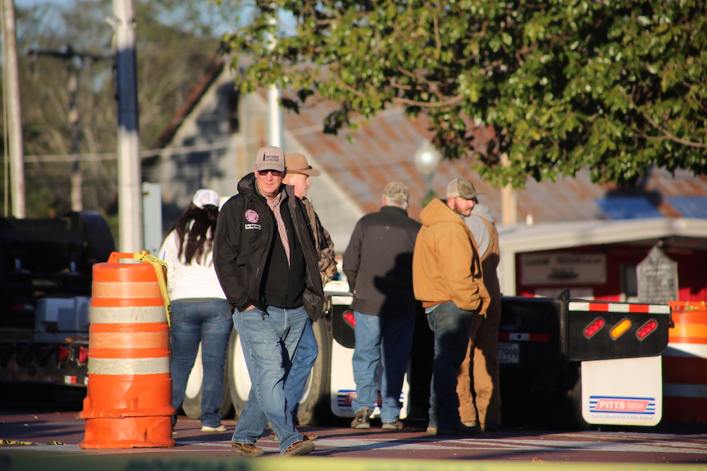 A group of people walking down the street.