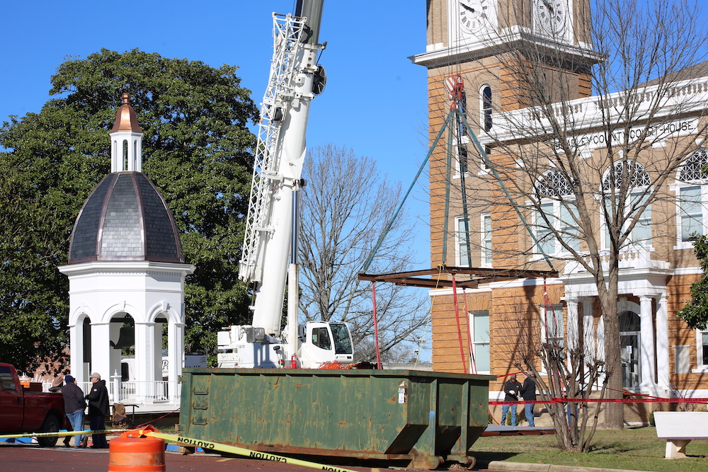 A crane is in the background of a building.