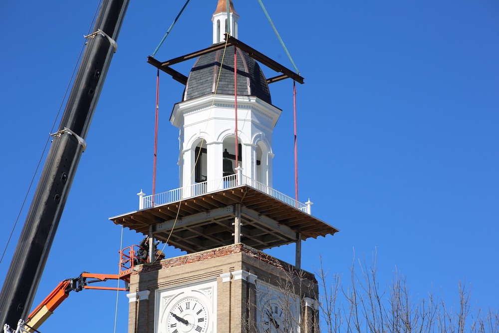A clock tower being built with scaffolding on top.