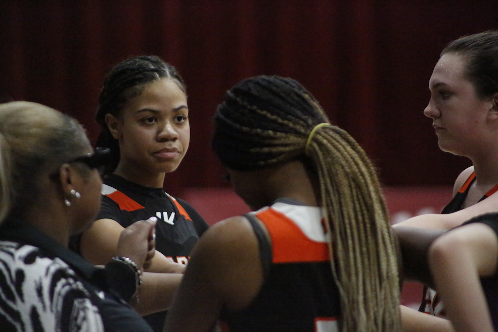 A group of young women standing next to each other.