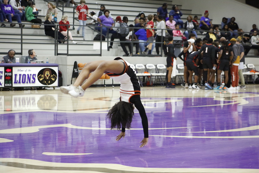 A person doing a handstand on the floor
