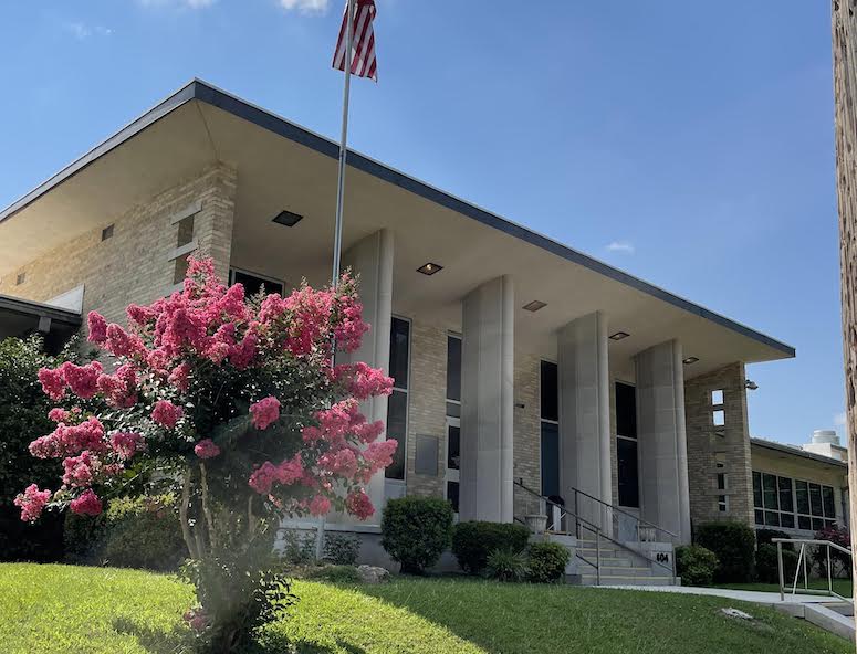 A building with flowers in front of it