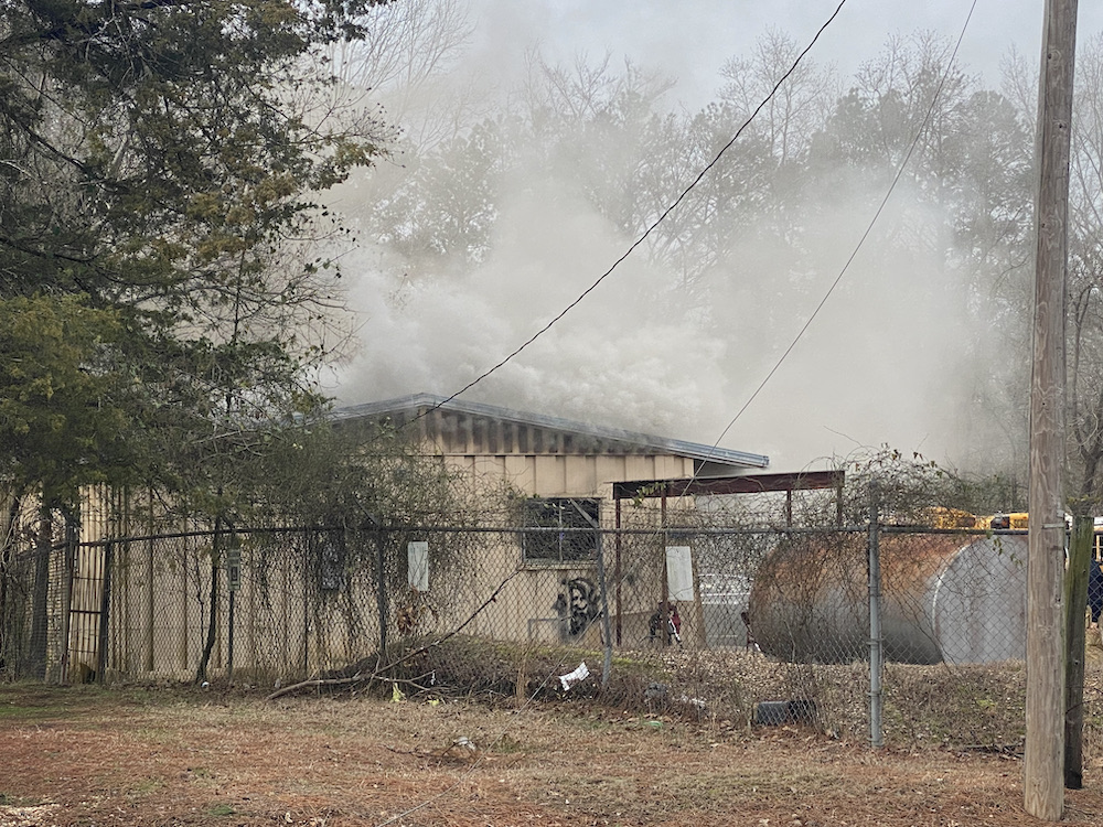 A fire that is burning in the middle of a building.