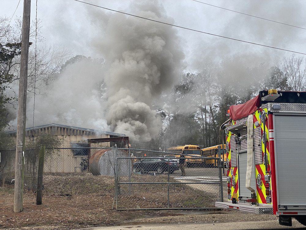 A fire truck is on the side of the road.