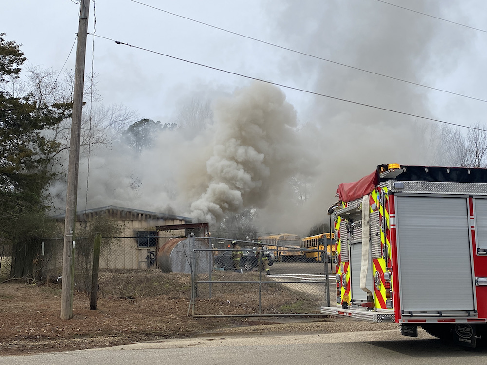 A fire truck is parked in front of a building.