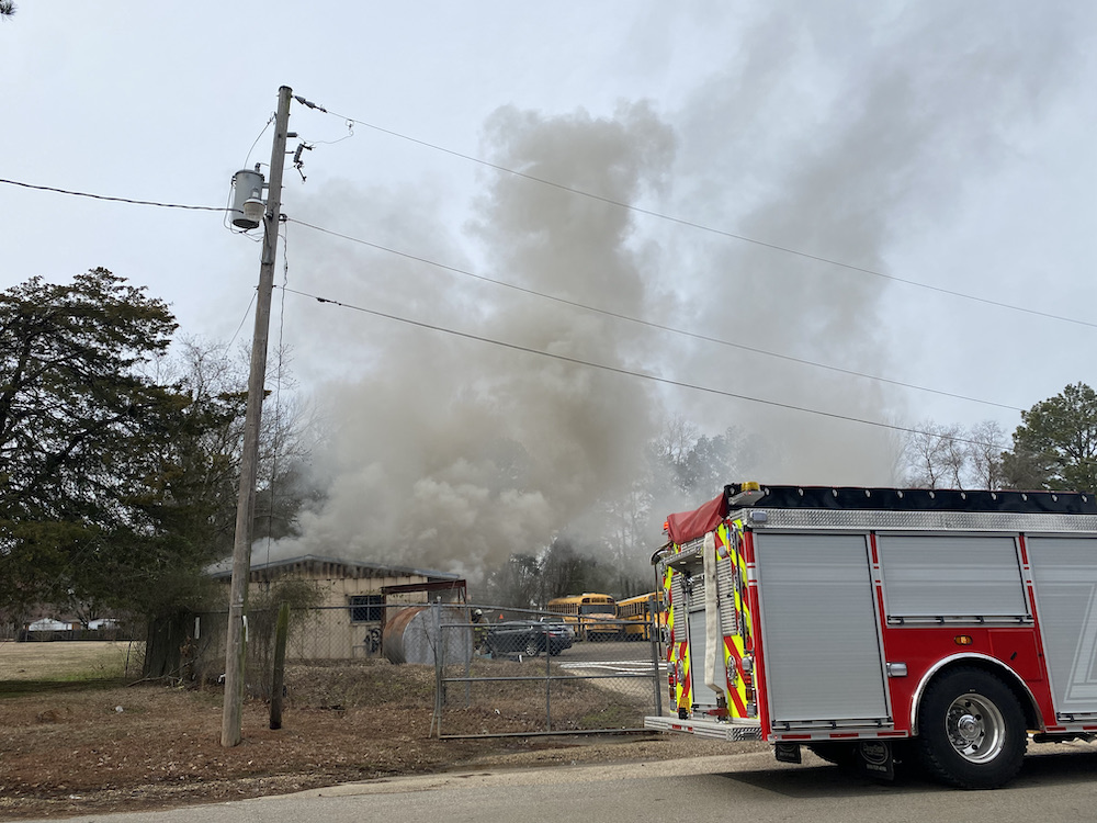 A fire truck is parked on the side of the road.
