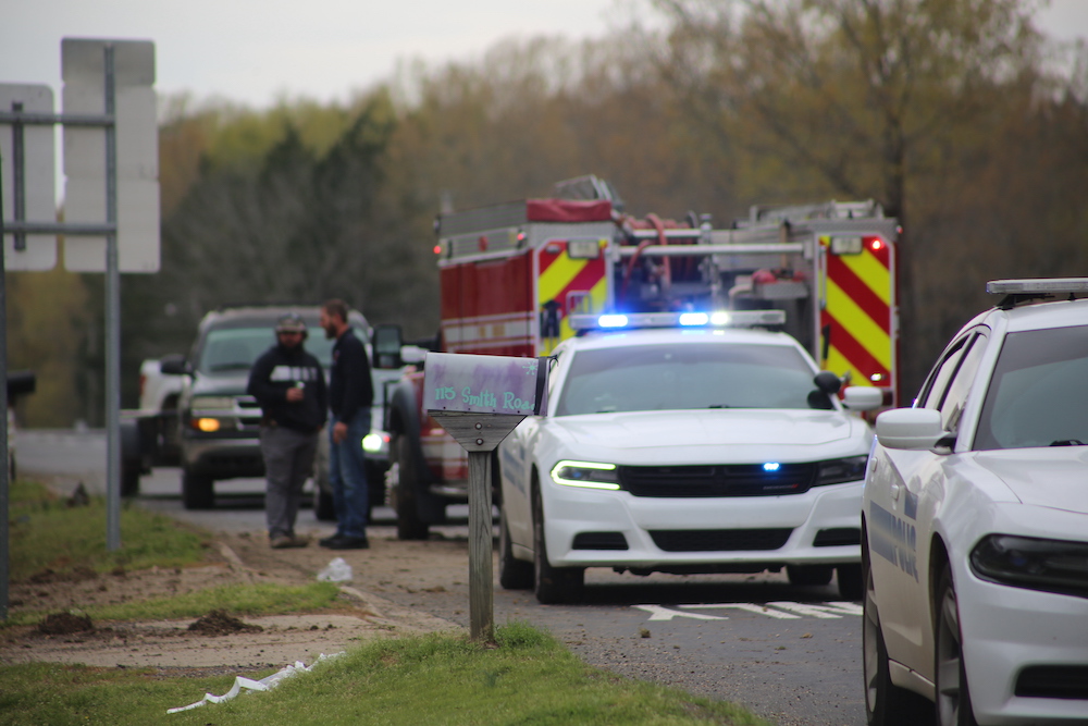A police car is parked on the side of the road.
