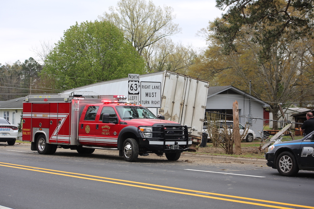 A red fire truck is parked on the side of the road.