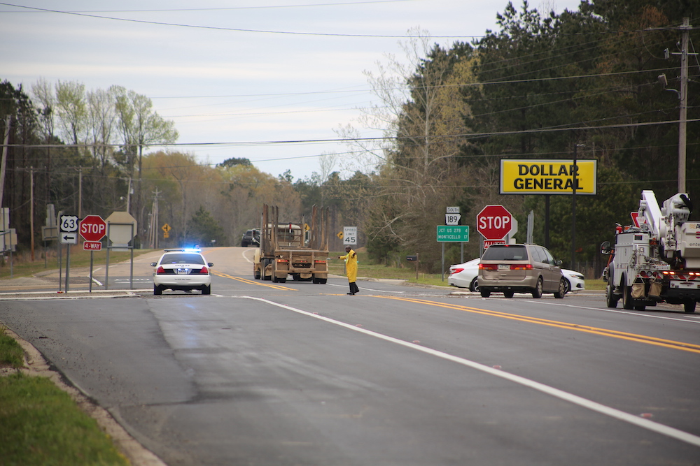 A police car and other vehicles on the road.