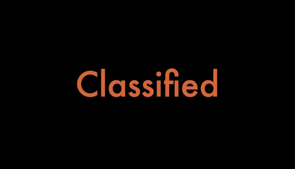 A black background with the word classified in orange.
