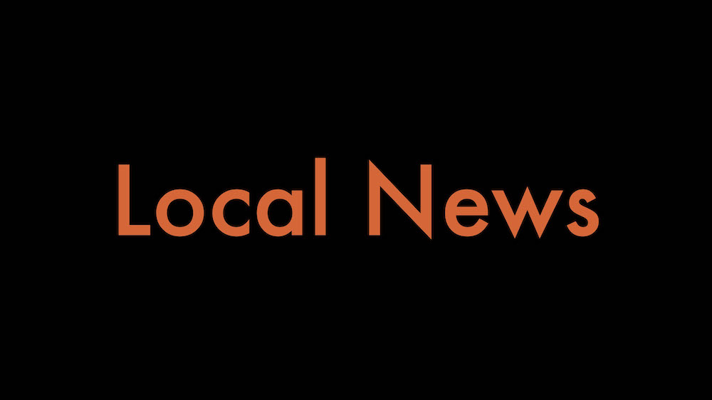 A black background with the words local news written in orange.