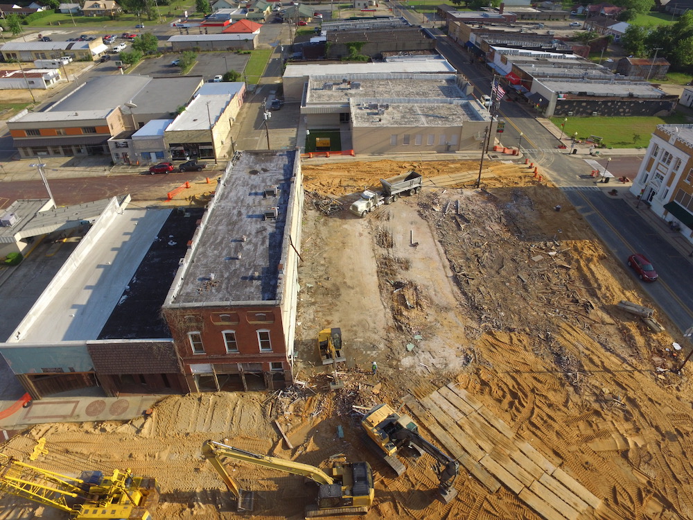 An aerial view of a construction site with buildings.