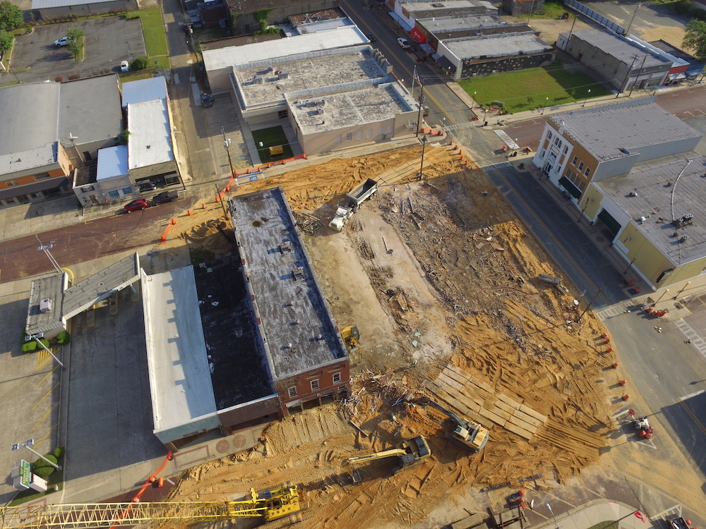An aerial view of a construction site with buildings.