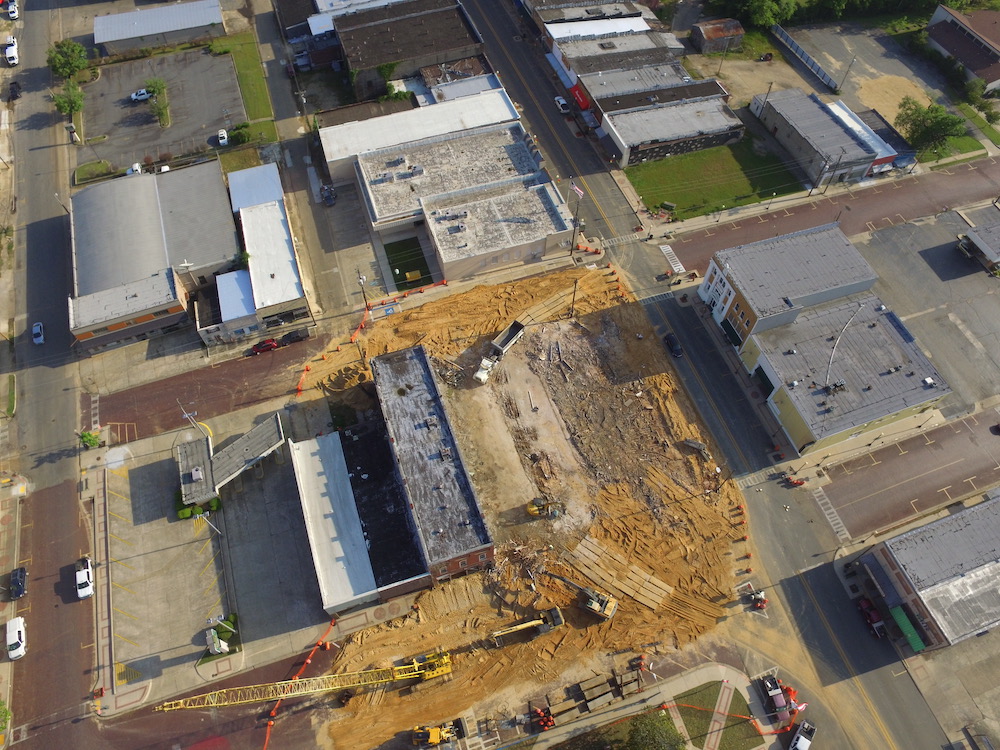 An aerial view of a construction site with buildings.