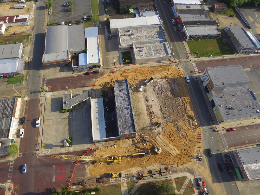 An aerial view of a construction site with buildings.
