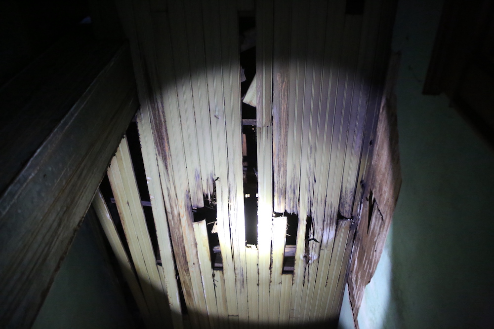 A wooden wall with some light shining on it