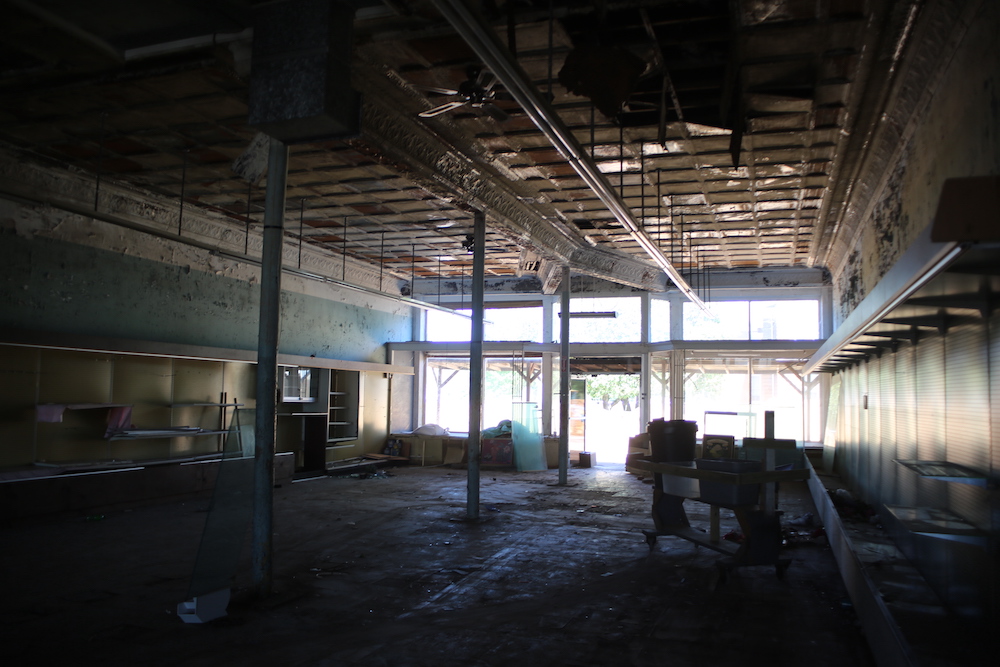 A large room with many windows and lots of ceiling space.
