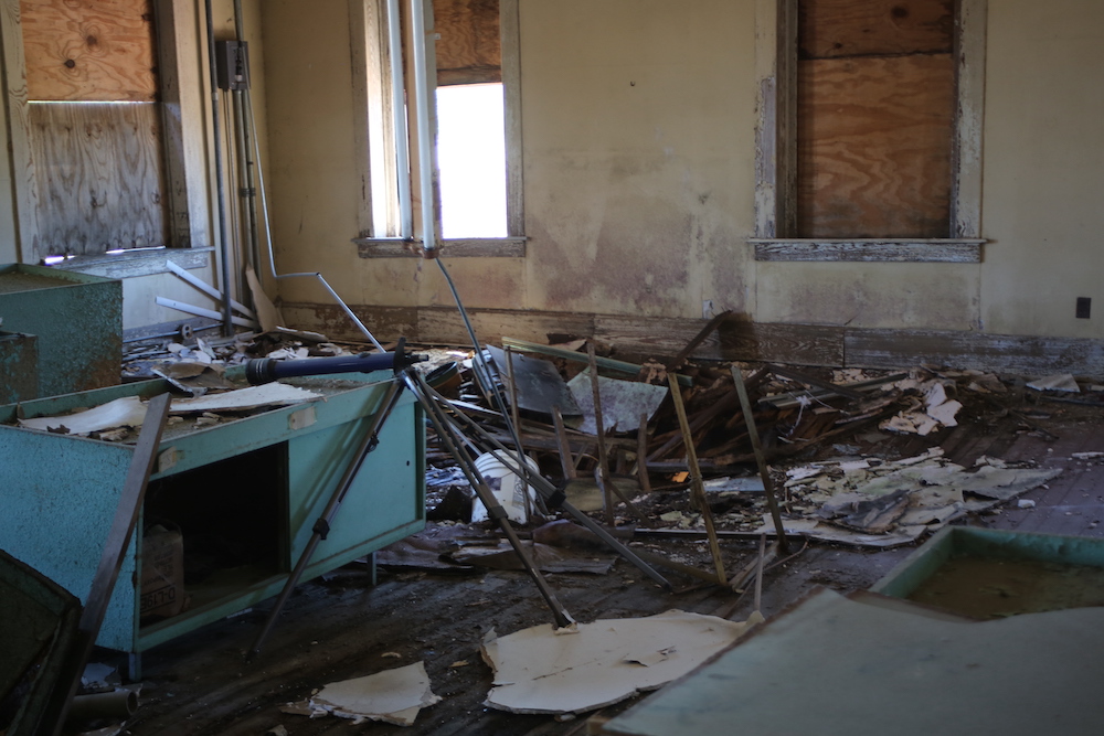 A room with debris and rubble scattered around.